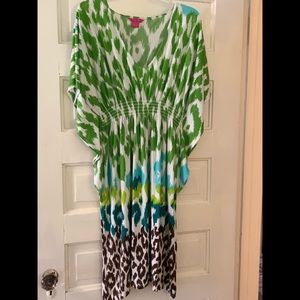 Sunny Leigh size medium dress. Has an elastic waist and “winged” sides. So cute